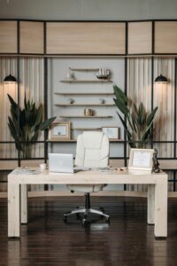 Elegant home office featuring a sleek desk, comfortable armchair, and stylish decor setup.